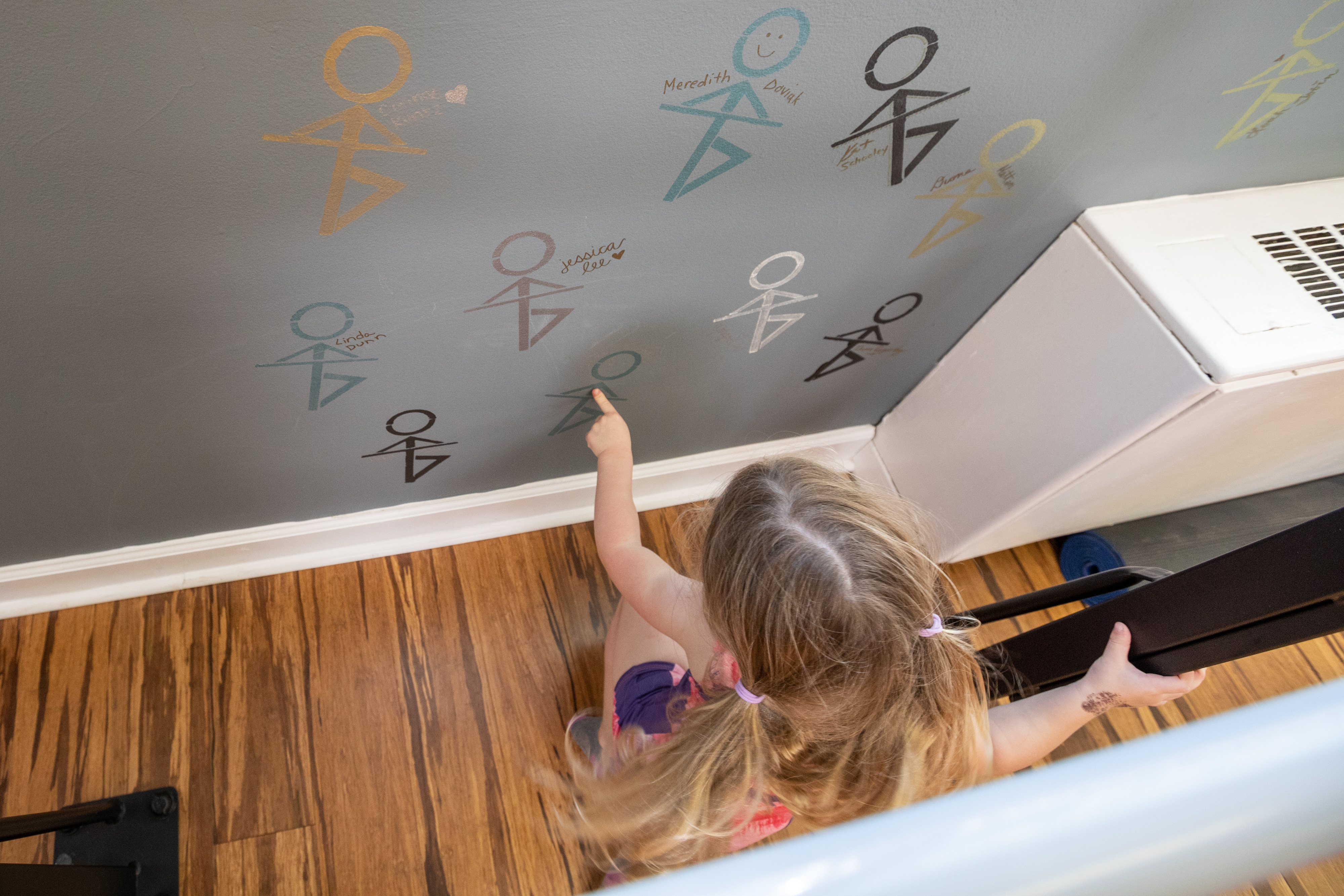 child pointing at painting